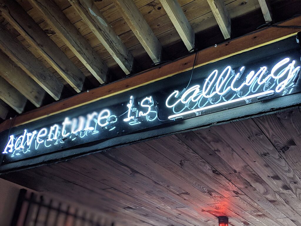 Adventure is calling sign at Back Porch Bar and Grill, Ft Lauderdale